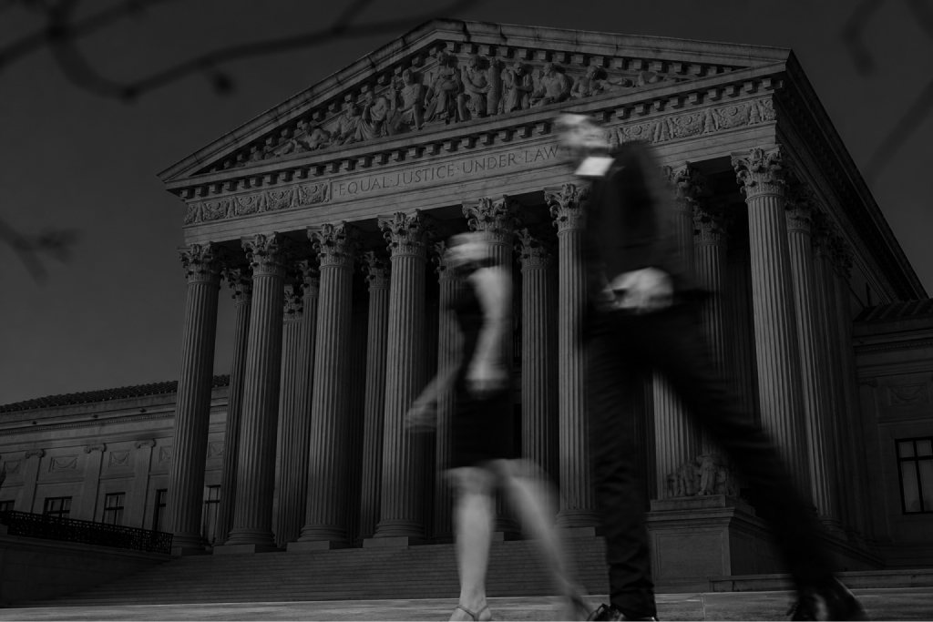 Courthouse facade with lawyers walking in motion blur
